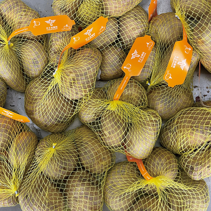 পেঁয়াজ রসুন এবং আলু প্যাকিং নেট ব্যাগ তৈরীর মেশিন প্যাকিং মেশিন স্বয়ংক্রিয় জাল নেট ব্যাগ Mutihead ওজন ফিলার মেশিন